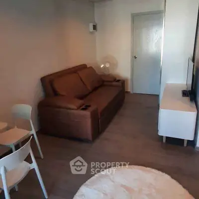 Cozy living room with brown sofa and modern decor