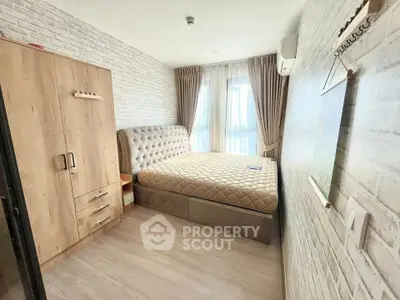 Cozy bedroom with modern decor and ample natural light