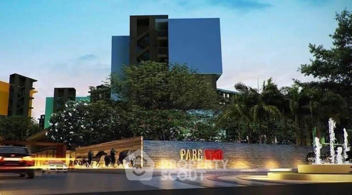Modern residential building entrance with lush greenery and stylish design