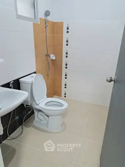 Modern bathroom with shower and toilet in a minimalist design