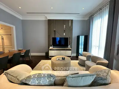 Luxurious living room with modern furniture and elegant decor, perfect for relaxation and entertainment.