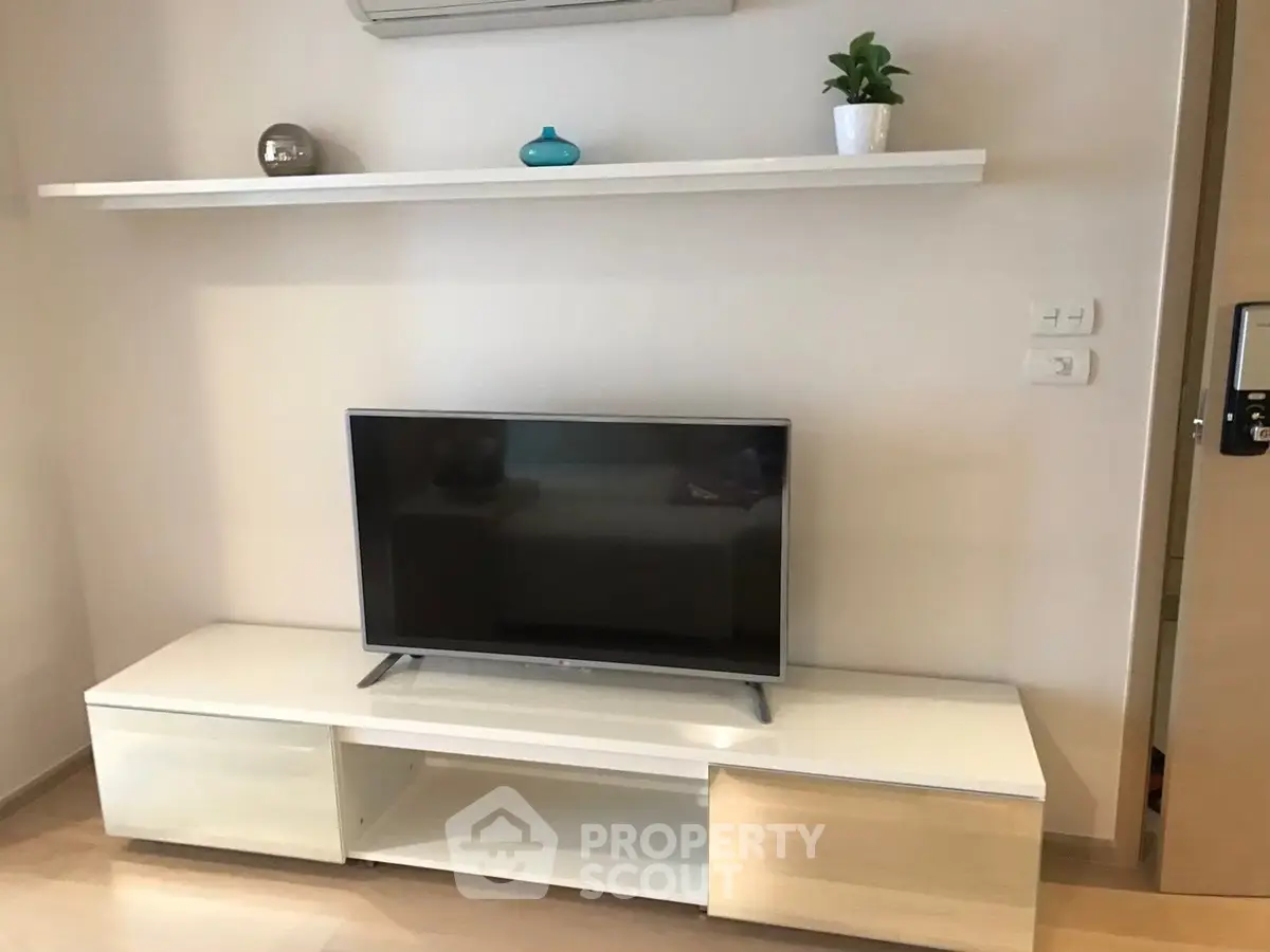Modern living room with sleek TV stand and minimalist decor
