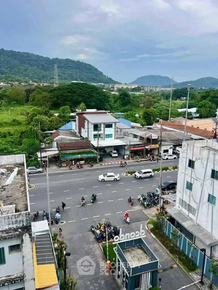 Scenic urban view with lush greenery and bustling street, ideal for real estate investment.