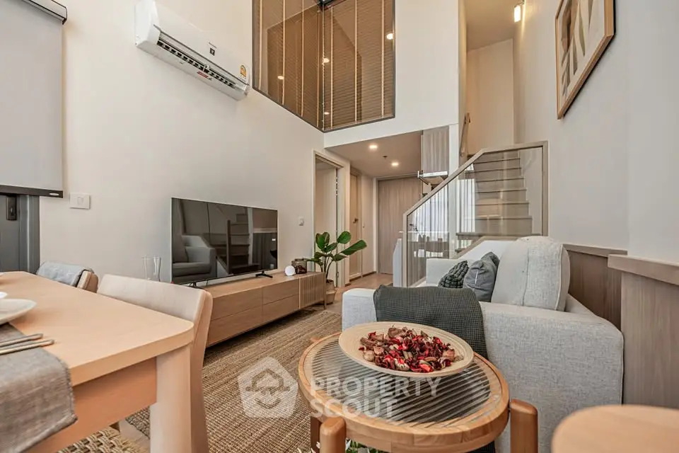 Modern living room with high ceiling and stylish decor