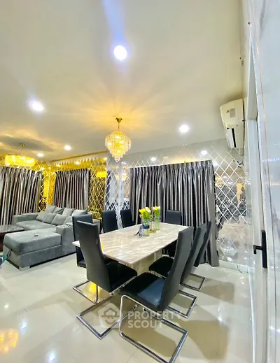 Luxurious living room with elegant dining area and modern decor