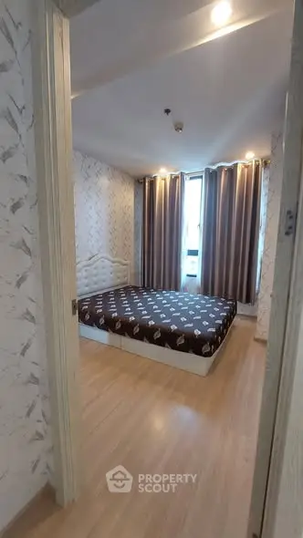 Cozy bedroom with modern decor and ample natural light