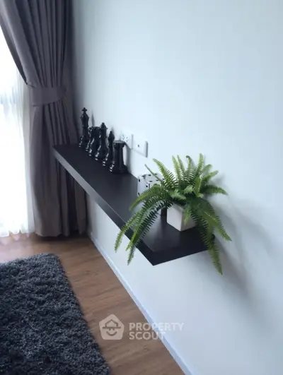Modern living room with floating shelf and elegant decor