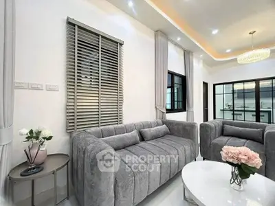 Elegant living room with plush gray sofas and modern decor