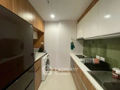 Modern kitchen with sleek cabinetry and integrated appliances