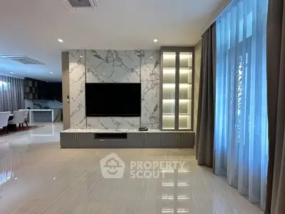 Luxurious living room with marble TV wall and elegant lighting