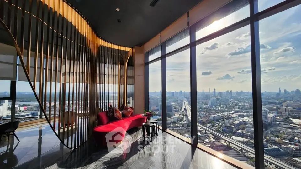 Luxurious high-rise living room with panoramic city views and elegant decor.