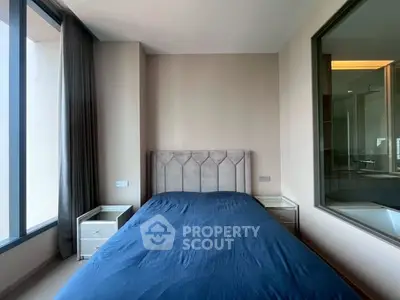 Modern bedroom with large window and stylish decor