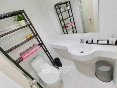Modern bathroom with sleek fixtures and stylish shelving