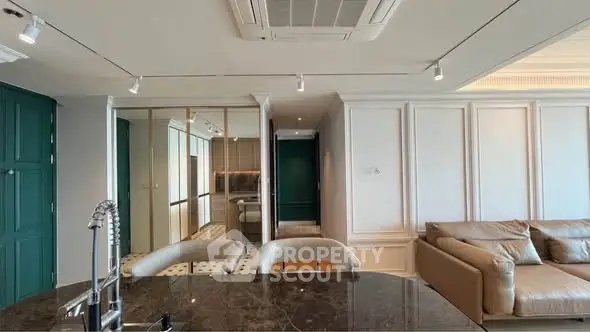Luxurious modern living room with elegant decor and open kitchen layout