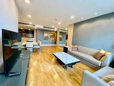 Spacious modern living room with hardwood floors and elegant decor