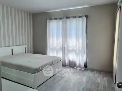 Bright and cozy bedroom with modern decor and natural light