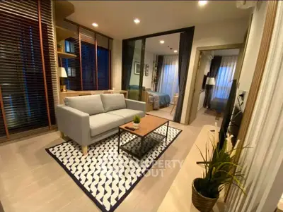 Modern living room with cozy seating and stylish decor in a contemporary apartment.