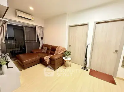 Cozy living room with leather sofa and balcony view