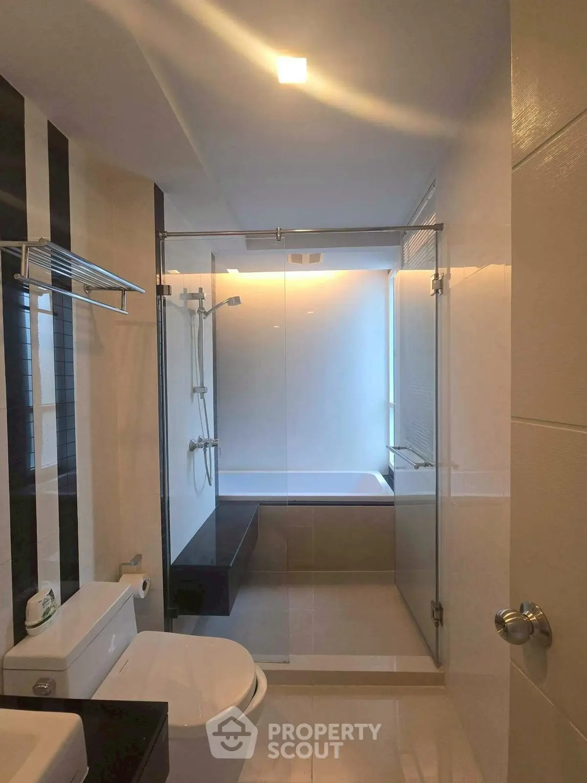 Modern bathroom with glass shower and sleek fixtures