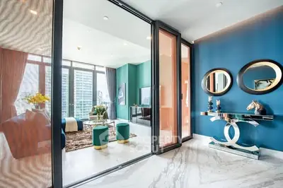 Luxurious modern living room with marble flooring and stylish decor in a high-rise apartment.