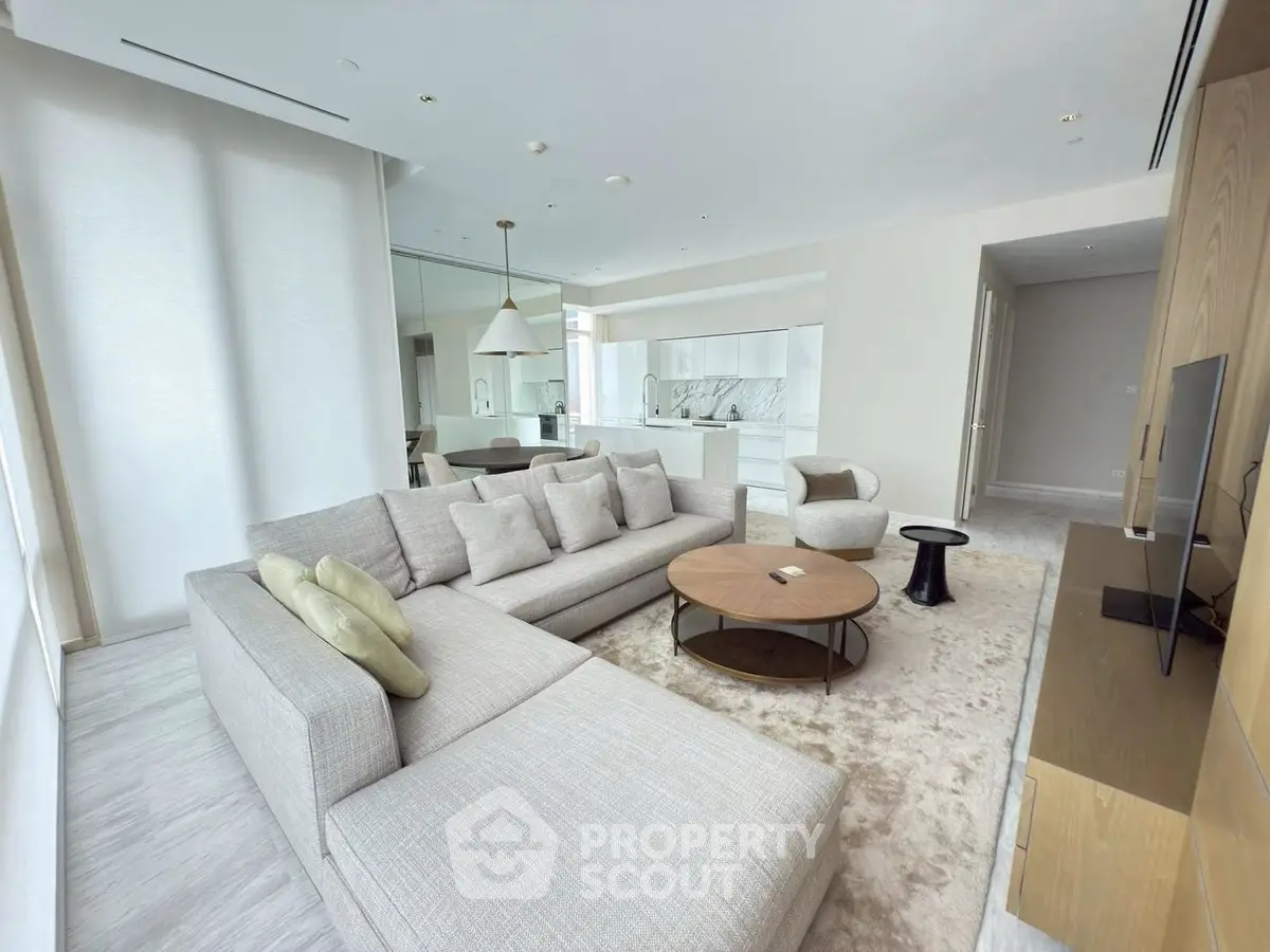 Spacious modern living room with elegant decor and open kitchen layout