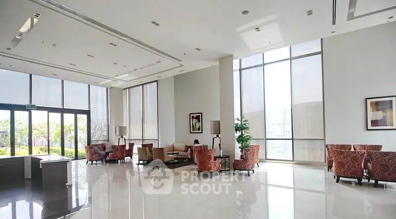 Spacious modern lobby with high ceilings and elegant seating area