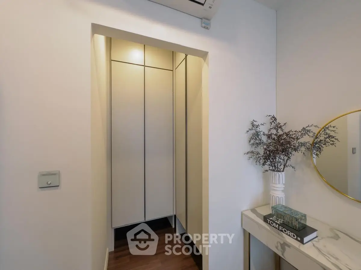 Stylish modern hallway with elegant decor and built-in storage