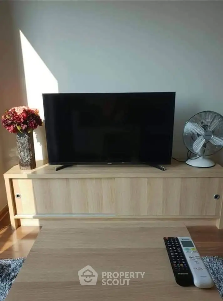 Modern living room with sleek TV setup and stylish decor