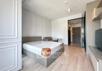 Modern bedroom with stylish decor and natural light in a contemporary apartment.