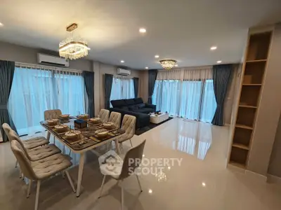 Spacious modern living room with elegant dining area and large windows