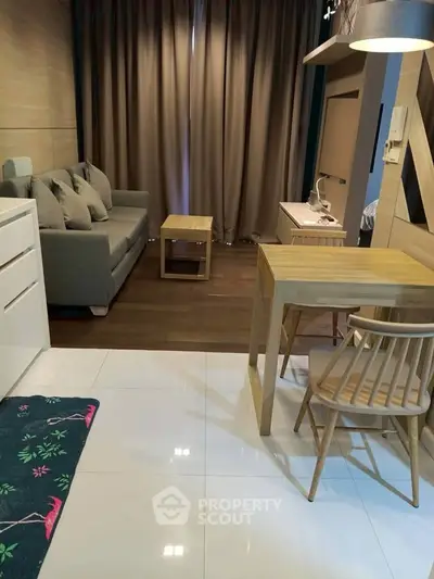 Modern studio apartment with cozy living area and stylish furniture