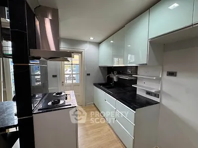 Modern kitchen with sleek cabinetry and gas stove in a stylish apartment