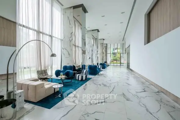 Luxurious modern lobby with marble floors and elegant seating area