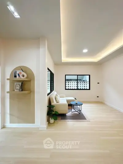 Modern living room with elegant lighting and cozy seating area