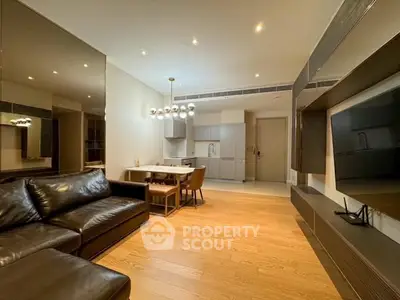 Modern living room with sleek furniture and open kitchen layout