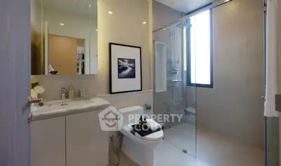 Modern bathroom with glass shower and elegant decor