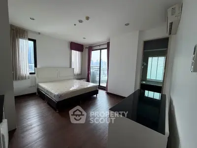 Spacious bedroom with city view and modern furnishings