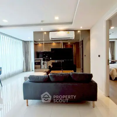 Modern living room with sleek design and large windows