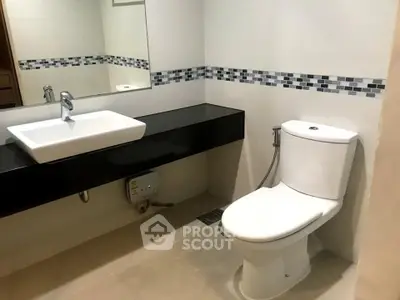 Modern bathroom with sleek fixtures and stylish tile accents