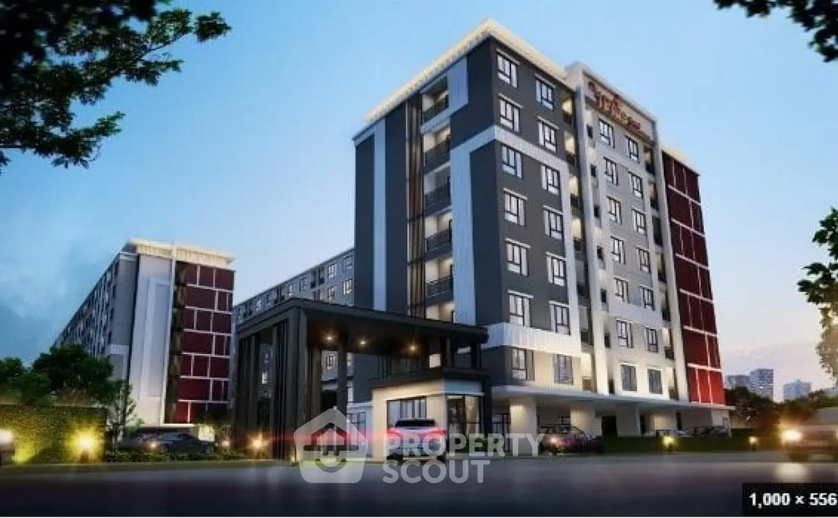 Modern apartment building exterior with sleek design and well-lit entrance, showcasing urban living at its finest.