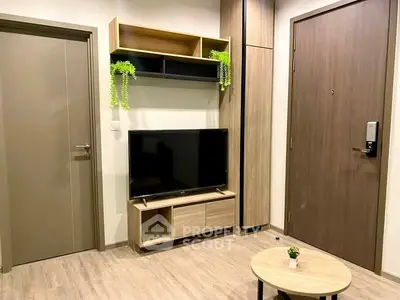 Modern living room with sleek TV stand and wooden accents, perfect for cozy urban living.