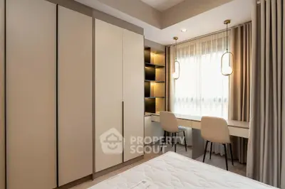 Modern bedroom with built-in wardrobe and stylish study area