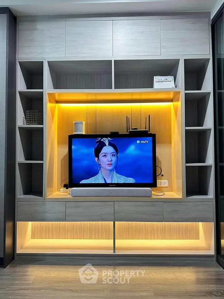 Modern living room with stylish entertainment center and ambient lighting