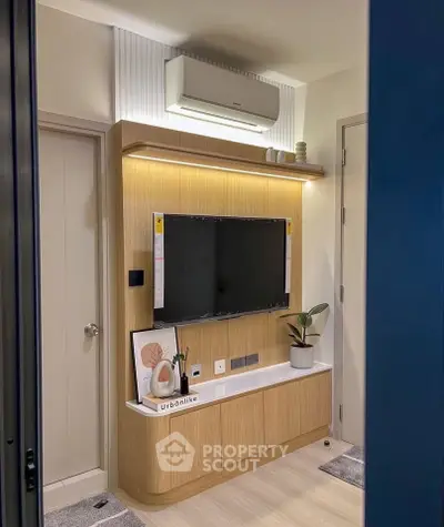 Modern living room with sleek TV unit and air conditioning