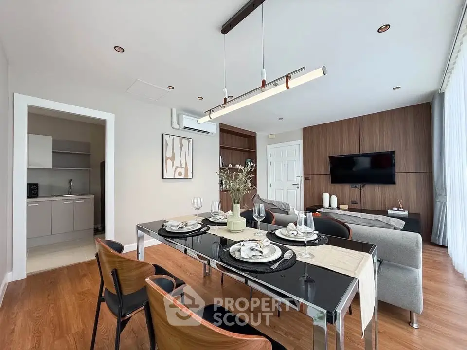 Modern dining and living area with elegant decor and natural light