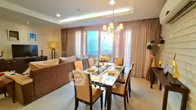 Luxurious living and dining area with elegant decor and city view, perfect for modern urban living.