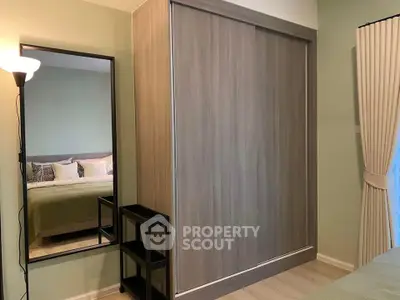 Cozy bedroom with sliding wardrobe and elegant decor