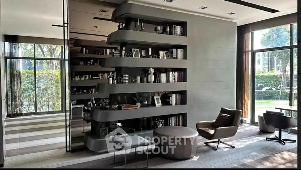 Luxurious modern living room with stylish shelving and large windows overlooking garden