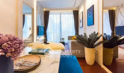 Luxurious modern living room with elegant decor and large windows offering natural light.