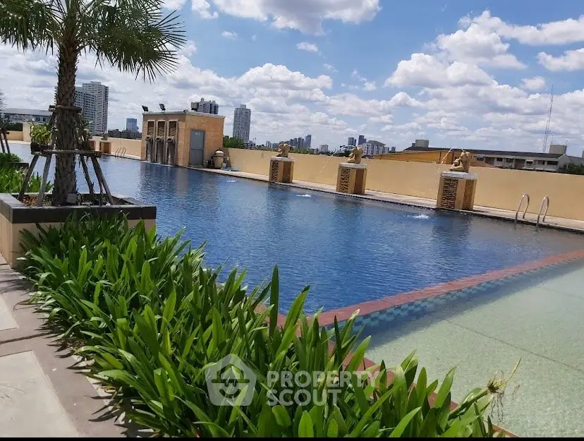 Luxurious rooftop pool with city skyline view and lush greenery